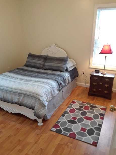 Bedroom 1 with full size bed. - 56 Fulton St Unit 3 FURNISHED