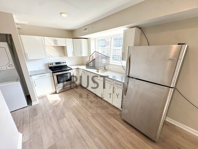 Building Photo - 5448 Springfield Ave Unit 1f