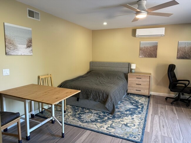 Queen size bed next to dining area, two sheet sets are included - 1977 Erbes Rd