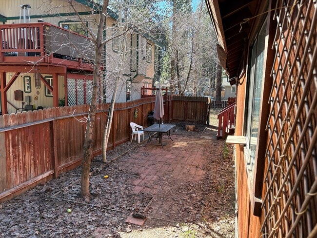 Photo - One level cabin with fenced backyard and garage