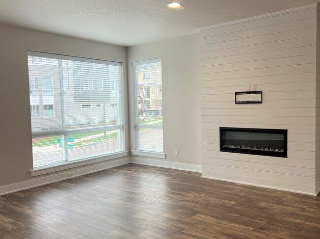Living Room with Ample Windows and Electric Fireplace - 12428 SW 171st Ter Rental