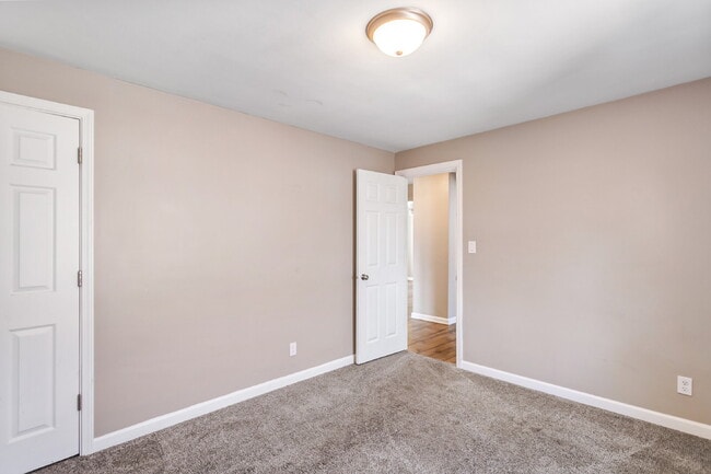 Photo - This spacious upper unit features 2 comfortable bedrooms with carpeting