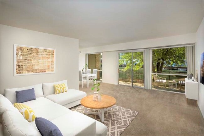 Spacious living area with a 20 ft. patio or balcony at Heritage Square Apartments