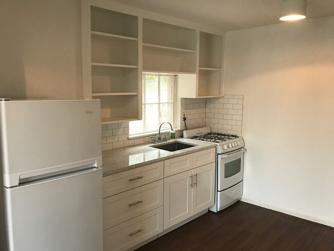 Kitchen: gas stove, carrera marble counters, - 1807 Garden St Apartment