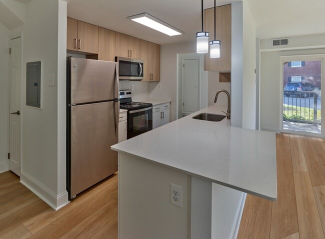 Kitchen with generous counter space - Delmont Apartments