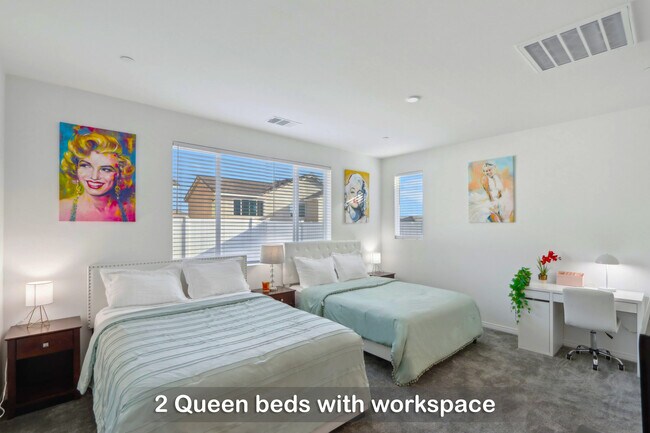 Two queen beds with a dedicated workspace for your convenience.