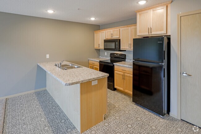2BR, 1BA Den - 1002 SF - Wolverine Meadows Apartments