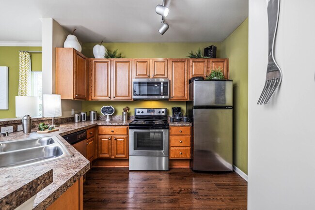 1 Bedroom with Sunroom: Kitchen with Stainless Steel Appliances - Wembly At Overlook