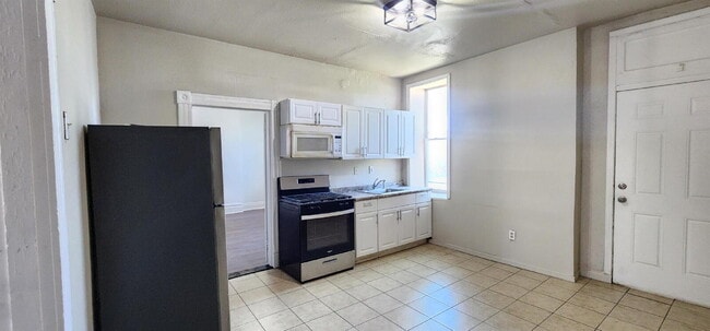 Photo - Spacious First-Floor 2BR with Bonus Room & Updated Interior – Pet Friendly!