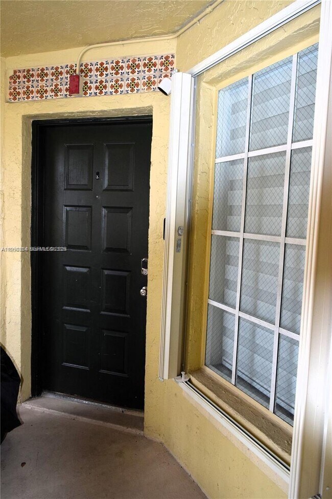 Building Photo - 18318 NW 68th Ave Unit E