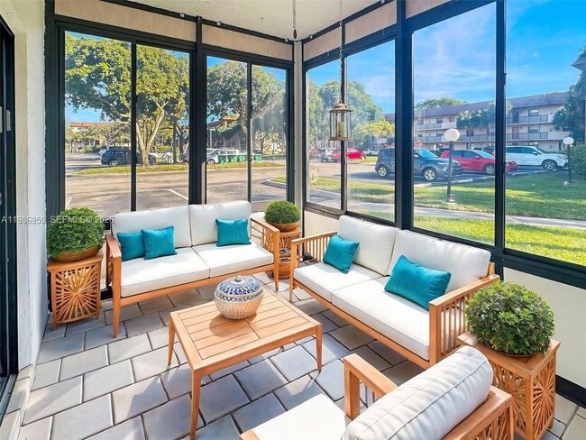 Building Photo - 6090 N Sabal Palm Blvd Unit 103