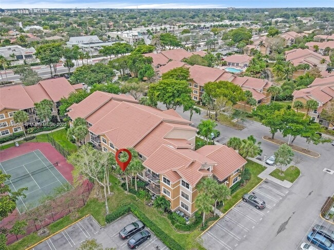 Building Photo - 8801 Wiles Rd Unit 104