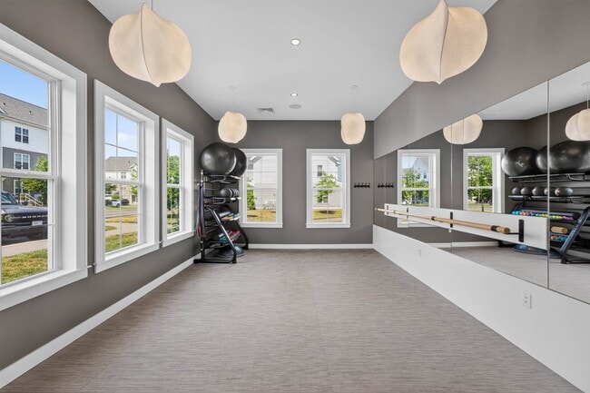 The barre and mirror wall make this the room for stretching and floor work.