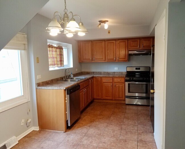 Photo - Cozy 3 bedroom 1.5 Bathroom Townhouse! Hardwood Throughout! Parking Included In Rent! Available f...