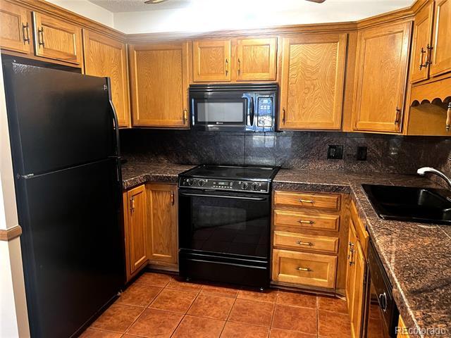 Building Photo - 3082 S Wheeling Way Unit 104