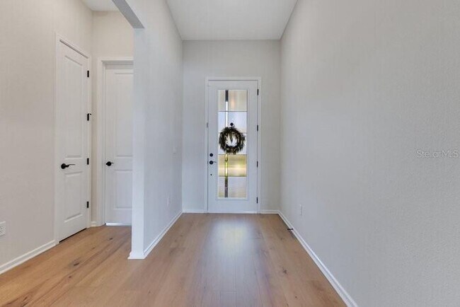 Photo - Waterfront Luxury in Isles of Lake Nona | 3-Car Garage, Resort Amenities & HOA-Included Cable, In...