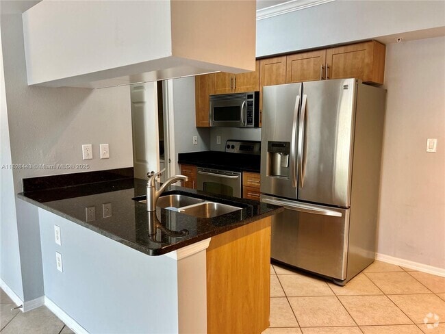 Building Photo - 6565 Emerald Dunes Dr Unit 202 Rental