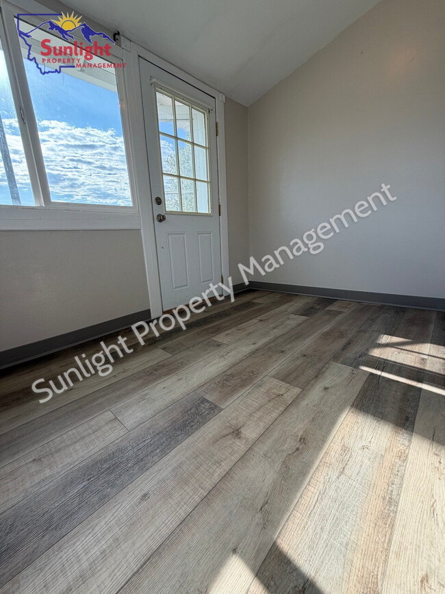 Photo - 2 Bed, 1 Bath Home with Detached Garage, Fenced Yard, and Built-In Storage