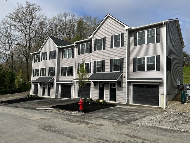 Building w/ garages - Saddle Rock Apartments