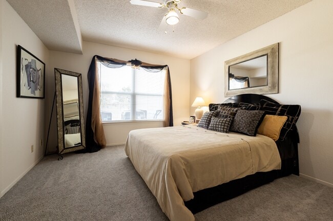Find your sanctuary in this cozy bedroom with dark wood accents, soft bedding, and plenty of natural light. The perfect place to unwind after a long day.