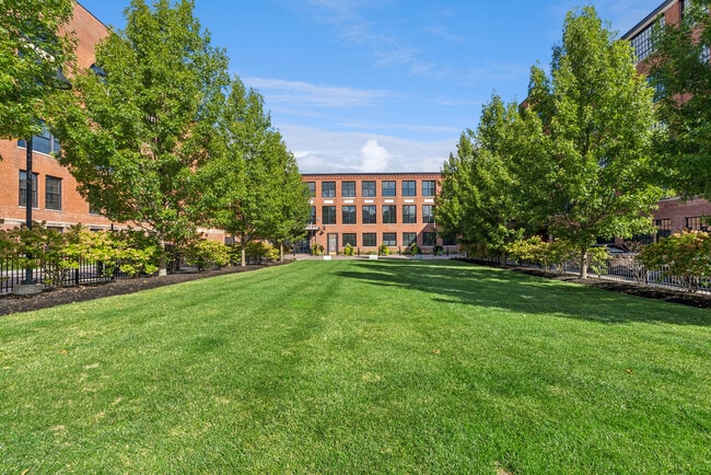 Expansive green space and landscaped courtyard at Voke Lofts
