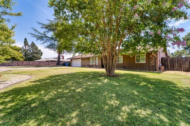 Photo - Spacious 4-Bedroom Home with Fenced Yard a...