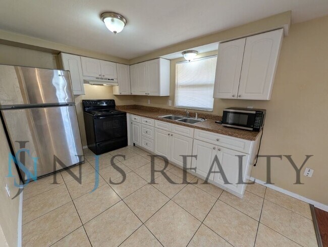 Photo - 2/2/1 1060 Sq. Ft with INDOOR LAUNDRY, a FULL garage, and fenced in yard!!