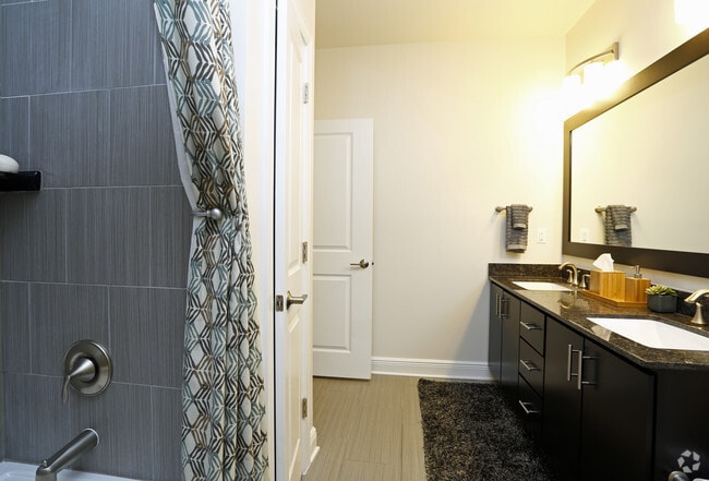 Hand laid tile floors and tile tub surrounds in each bathroom! - Berkshire Ninth Street