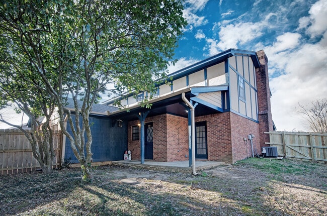Private covered back porch ideal for entertaining or unwinding at the end of the day. - 2461A River Oaks Blvd