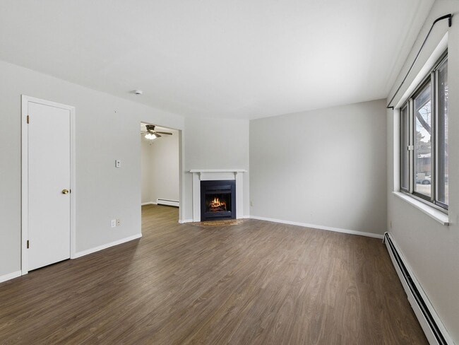 Photo - Spacious 2 Bed Condo W/ Bonus Basement Room, Fireplace & Garage Available NOW!