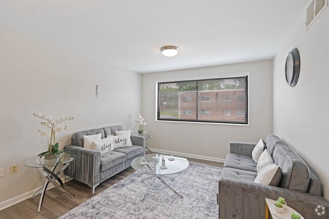 2BR, 1BA - 833SF - Living Room - Flats of Forestville