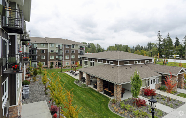 Back Lawn and Pool House - Affinity at Bellingham 55+ Apartments