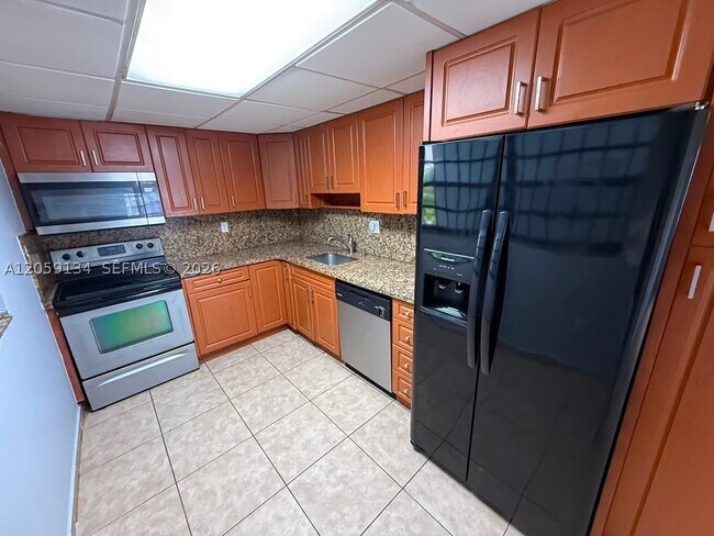 Building Photo - 1325 W 68th St Unit 111
