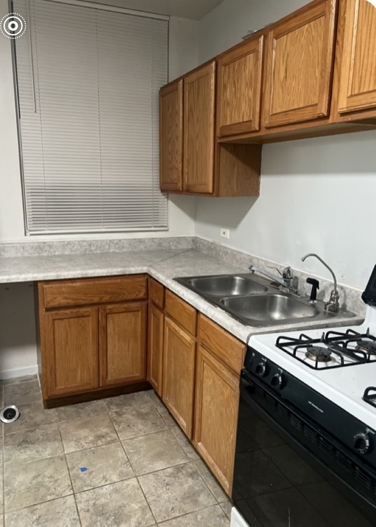 Kitchen and front room, one bedroom - 537 W 31st St Apartments Unit 1