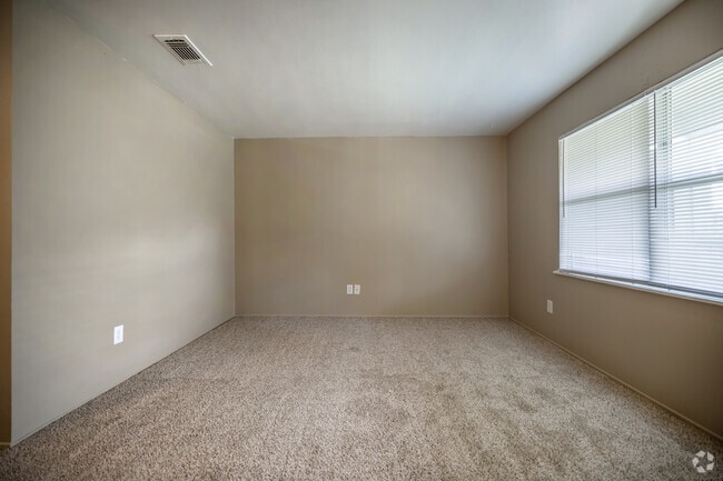 1BR, 1BA - 675SF - Large Living Room w/ Picture Window - Royal Oaks Apartments
