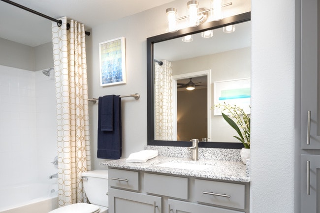 Contemporary bathrooms with soaking tubs and upgraded lighting