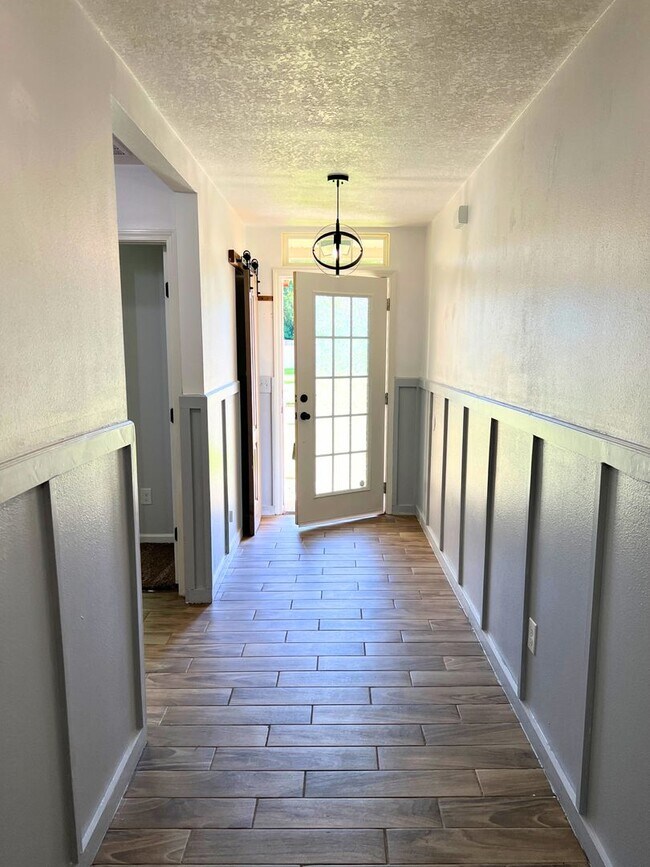 Photo - Stylish 4-Bedroom Home with Fenced Yard – Prime Location!