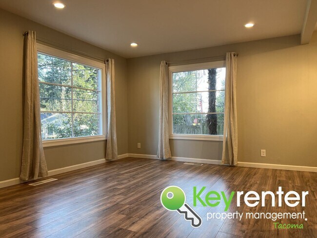 Photo - Modern Fircrest Gem: Sleek Design, Quartz Counters & Natural Oasis!