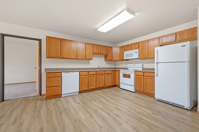 Step into modern living with the inviting kitchen at Paramount at the Bluffs Apartments. Featuring ample cabinetry and contemporary appliances, this space is perfect for culinary creativity. Find your ideal home today!