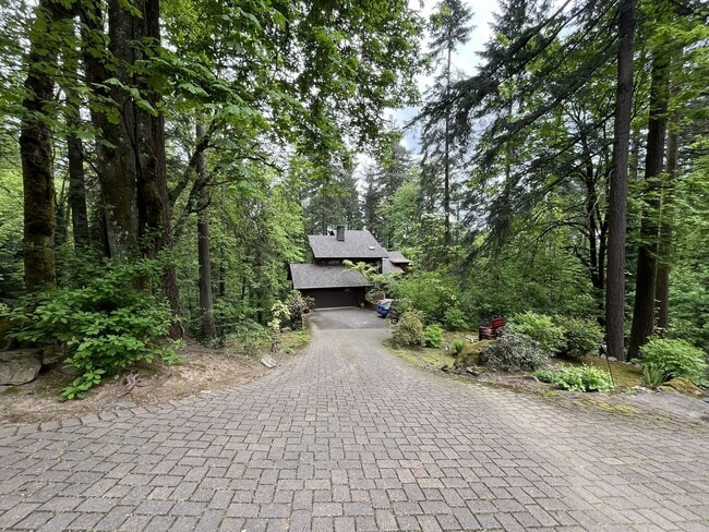 Photo - One-of-a-Kind Custom Home with Wall of Windows, Stone Fireplaces, Expansive Entertainment Space &...