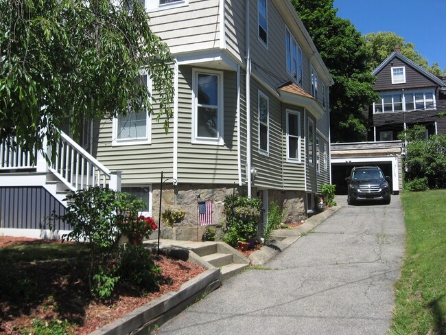 View from road up driveway to garage. - 149 Willow Street Apartment Unit 149 Willow Street