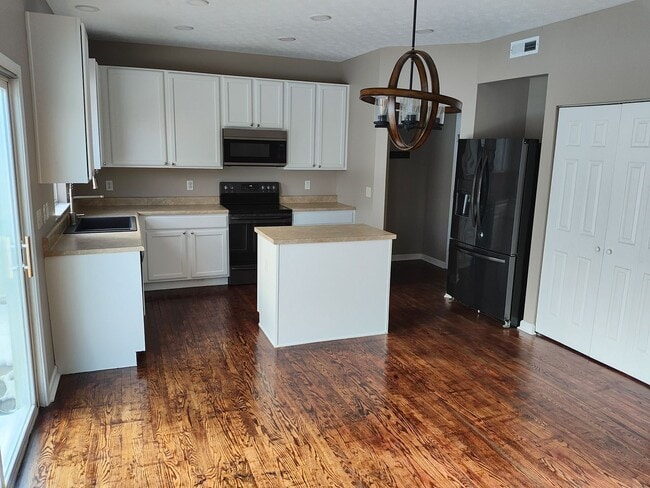 Photo - Beautifully maintained 4-bedroom, 2.5-bath over 2,200 sqft with a 2 car garage!