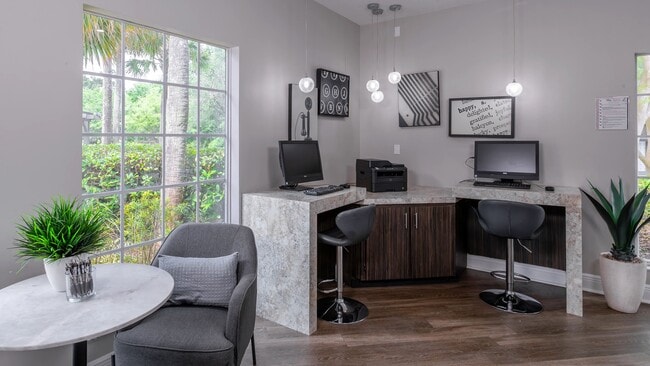 Designed for convenience and focus, our resident business center offers desktop computers, a printer, and a quiet, welcoming environment. - The Enclave at Huntington Woods