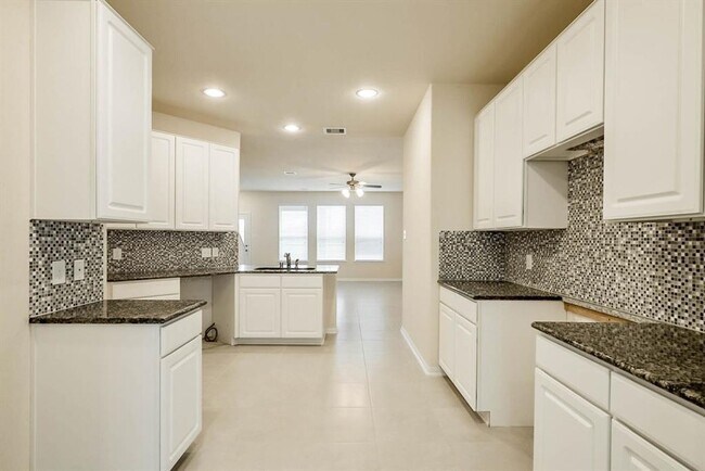 Photo - Beautiful stone front 4 bedroom, 3 bath home has bay windows in breakfast nook & master. It is on...