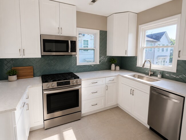 Fully renovated kitchen featuring new GE Appliances, quartz countertops