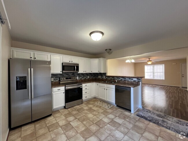 Building Photo - End Unit Townhome with Unfinished Basement