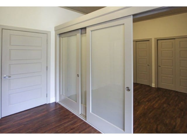 Sliding glass wall partitions for desired privacy