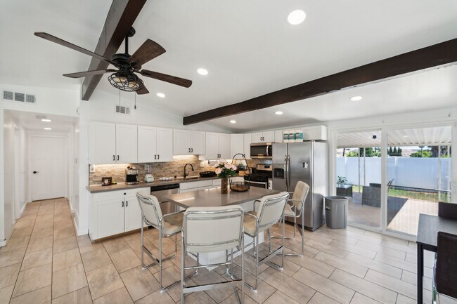 The kitchen and kitchenette are equipped with essential cooking tools - 9853 Saint George St