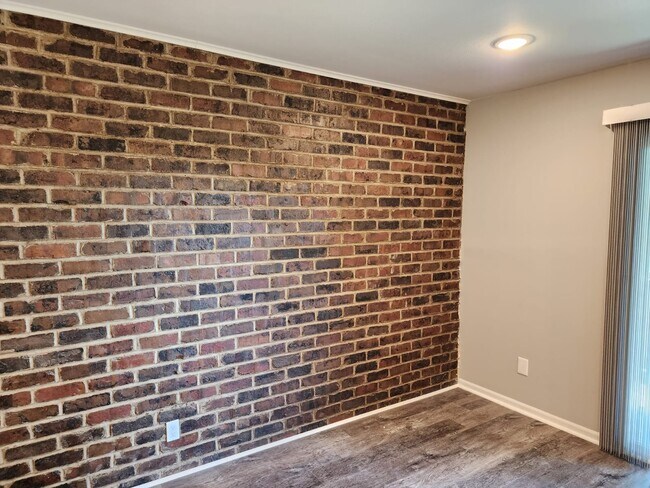 Exposed Brick Wall - Pinecrest Apartments