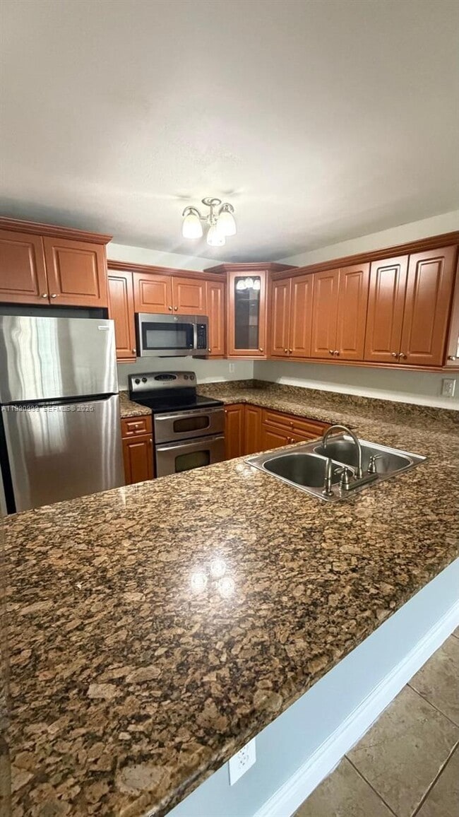 Building Photo - 6980 NW 186th St Unit 3-126